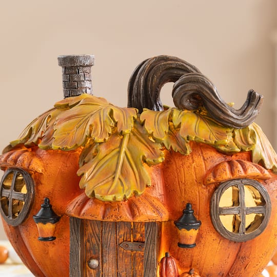 Glitzhome® 8.5" Lighted Fall Resin Pumpkin House Table Decor with Timer
